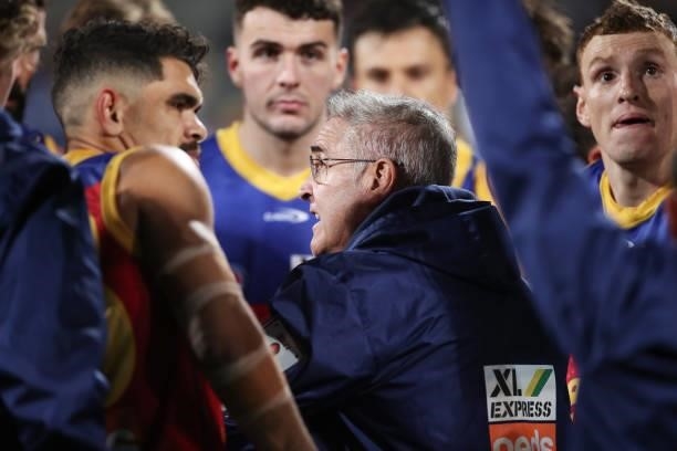 Lions head coach Chris Fagan speaks to his players during the round 14 AFL match between the North Melbourne Kangaroos and the Brisbane Lions at...