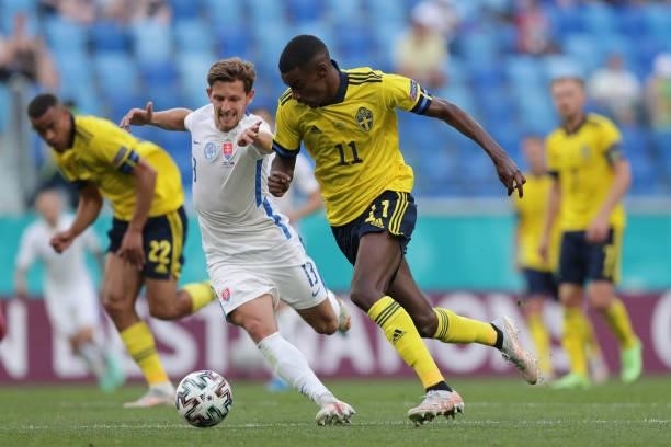 Alexander Isak of Sweden competes for the ball with Patrik Hrosovsky of Slovakia during the UEFA Euro 2020 Championship Group E match between Sweden...