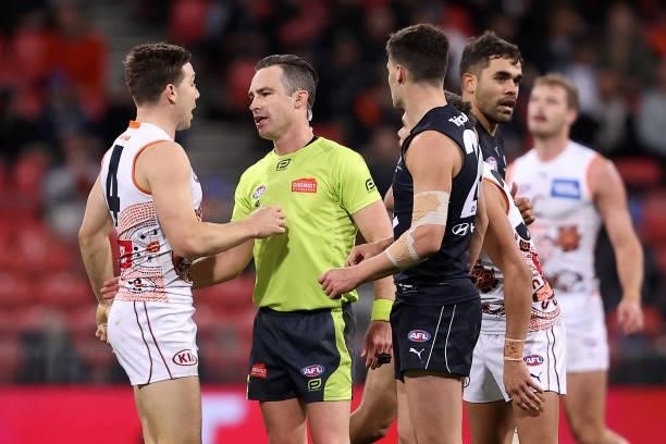 Toby Greene of the Giants is placed on report following an incident with Nic Newman of the Blues during the round 14 AFL match between the Greater...