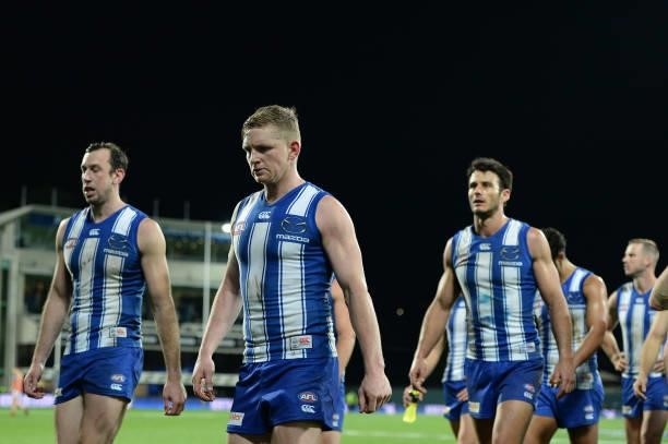 Jack Ziebell of the Kangaroos leaves the field after the game during the round 14 AFL match between the North Melbourne Kangaroos and the Brisbane...