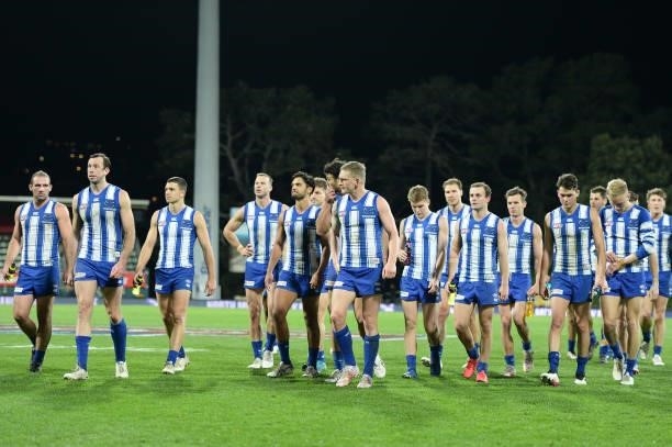 Kangaroos leave the field after the game during the round 14 AFL match between the North Melbourne Kangaroos and the Brisbane Lions at Blundstone...