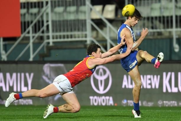 Jy Simpkin of the Kangaroos kicks the ball during the round 14 AFL match between the North Melbourne Kangaroos and the Brisbane Lions at Blundstone...