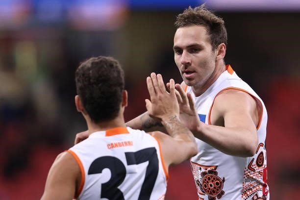 Jeremy Finlayson of the Giants is congratulated by Bobby Hill after kicking a goal during the round 14 AFL match between the Greater Western Sydney...