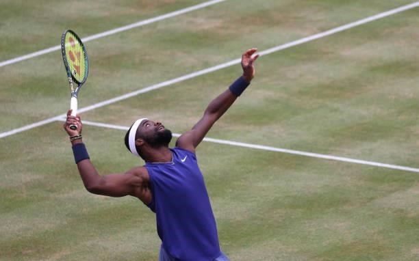 Frances Tiafoe of USA serves during his Quarter-final match against Denis Shapovalov of Canada during Day 6 of The cinch Championships at The Queen's...