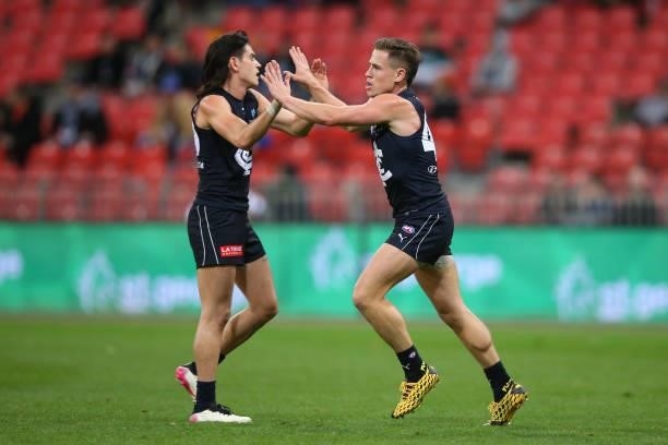 Matthew Owies of the Blues celebrates kicking a goal during the round 14 AFL match between the Greater Western Sydney Giants and the Carlton Blues at...