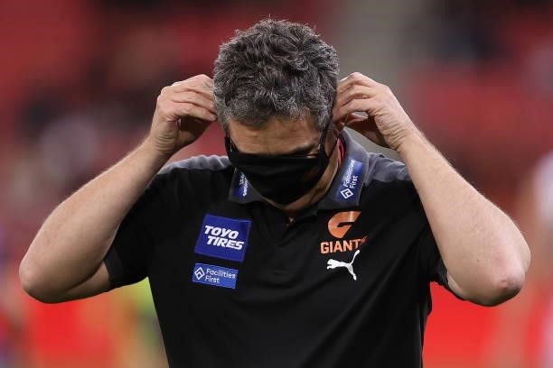 Giants head coach Leon Cameron puts on his mask after talking to his players during the round 14 AFL match between the Greater Western Sydney Giants...