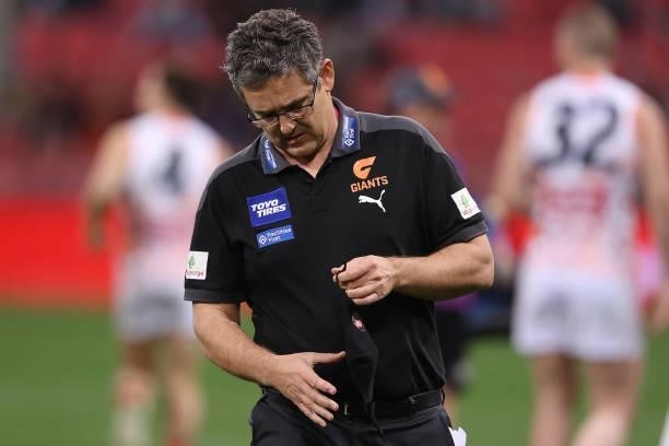 Giants head coach Leon Cameron puts on his mask after talking to his players during the round 14 AFL match between the Greater Western Sydney Giants...