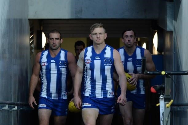 Jack Ziebell of the Kangaroos leads out the team during the round 14 AFL match between the North Melbourne Kangaroos and the Brisbane Lions at...