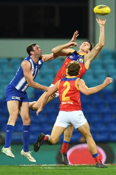 Oscar McInerney of the Lions and Todd Goldstein of the Kangaroos compete in a ruck contest during the round 14 AFL match between the North Melbourne...