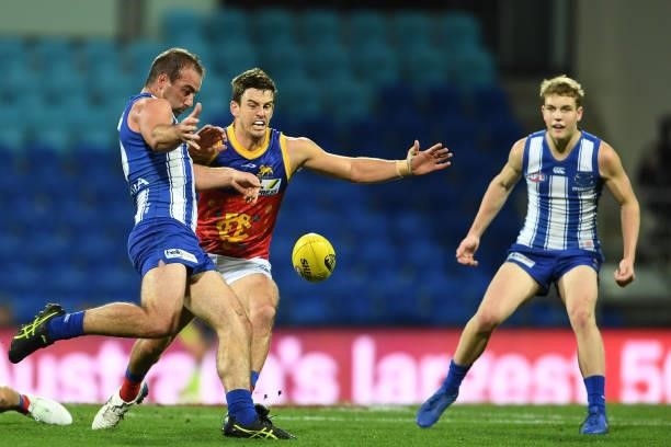 Ben Cunnington of the Kangaroos kicks the ball during the round 14 AFL match between the North Melbourne Kangaroos and the Brisbane Lions at...