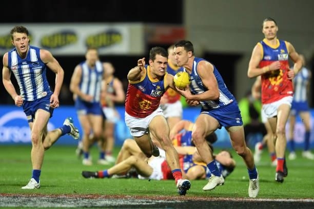 Luke Davies-Uniacke of the Kangaroos runs the ball during the round 14 AFL match between the North Melbourne Kangaroos and the Brisbane Lions at...