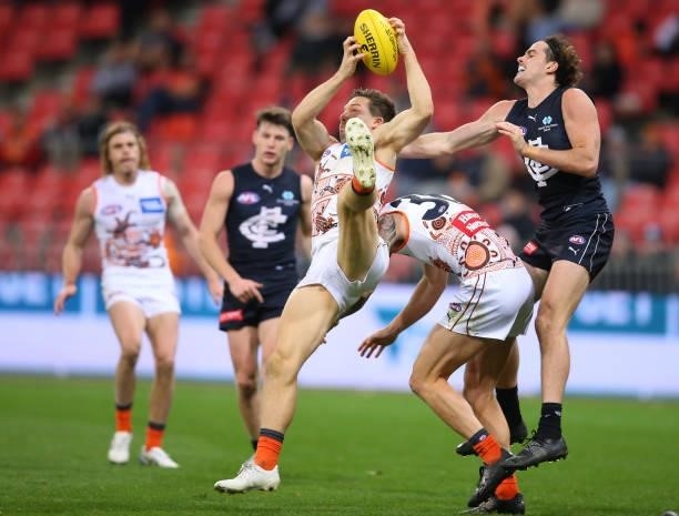 Toby Greene of the Giants marks the ball during the round 14 AFL match between the Greater Western Sydney Giants and the Carlton Blues at GIANTS...