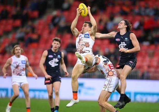 Toby Greene of the Giants marks the ball during the round 14 AFL match between the Greater Western Sydney Giants and the Carlton Blues at GIANTS...