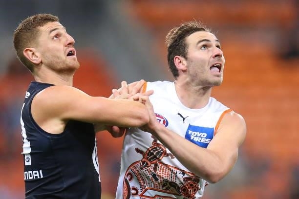 Liam Jones of the Blues and Jeremy Finlayson of the Giants compete for the ball during the round 14 AFL match between the Greater Western Sydney...
