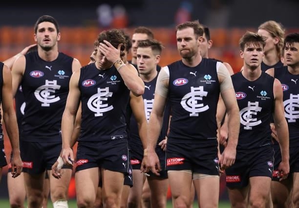 The Blues look dejected after losing the round 14 AFL match between the Greater Western Sydney Giants and the Carlton Blues at GIANTS Stadium on June...