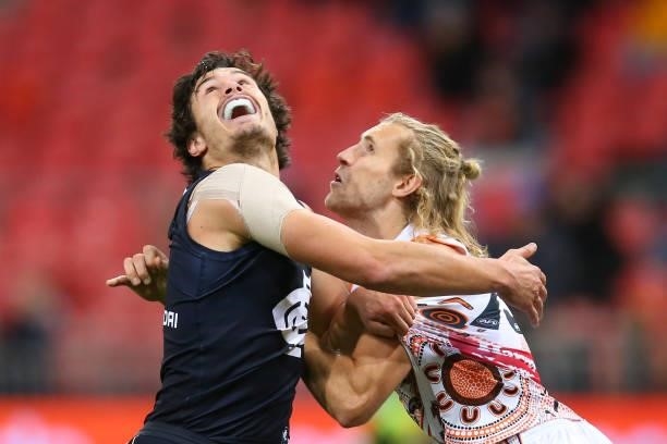 Jack Silvagni of the Blues and Nick Haynes of the Giants compete for the ball during the round 14 AFL match between the Greater Western Sydney Giants...