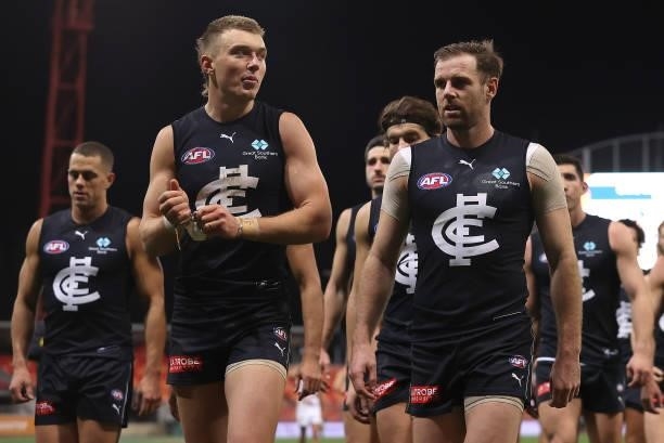 Patrick Cripps and Sam Docherty and their Blues team mates look dejected after losing the round 14 AFL match between the Greater Western Sydney...