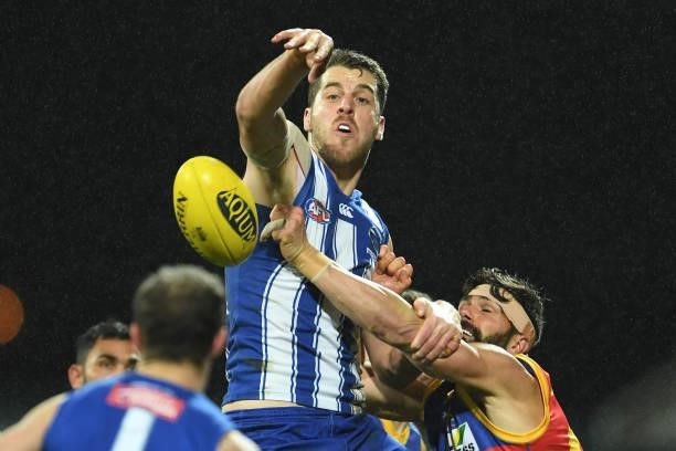Tristan Xerri of the Kangaroos competes in a ruck contest during the round 14 AFL match between the North Melbourne Kangaroos and the Brisbane Lions...