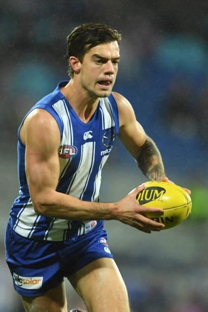 Jy Simpkin of the Kangaroos runs the ball during the round 14 AFL match between the North Melbourne Kangaroos and the Brisbane Lions at Blundstone...
