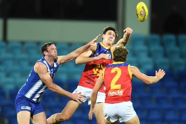 Oscar McInerney of the Lions and Todd Goldstein of the Kangaroos compete for the ball during the round 14 AFL match between the North Melbourne...