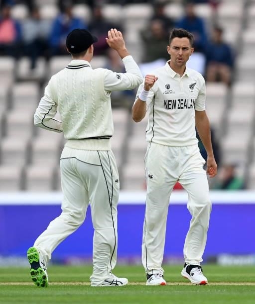 Trent Boult of New Zealand celebrates with Devon Conway after dismissing Cheteshwar Pujara of India during Day 2 of the ICC World Test Championship...