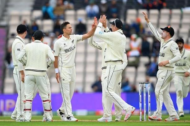 Trent Boult of New Zealand celebrates the wicket of Cheteshwar Pujara of India with teammates during Day 2 of the ICC World Test Championship Final...