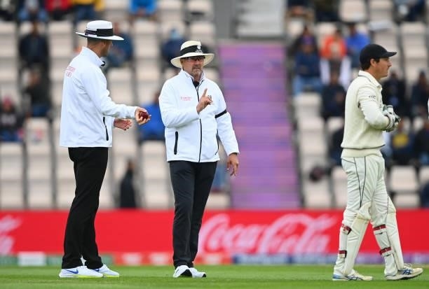 Umpire Richard Illingworth shows the soft signal as out for the wicket of Virat Kohli of india which is later overturned alongside Michael Gough...