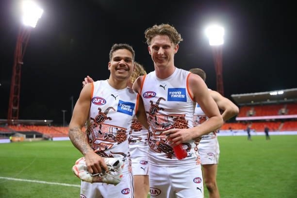 Bobby Hill of the Giants and Lachie Whitfield of the Giants celebrate victory during the round 14 AFL match between the Greater Western Sydney Giants...