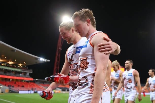 Harry Himmelberg of the Giants and Tom Green of the Giants celebrate victory during the round 14 AFL match between the Greater Western Sydney Giants...