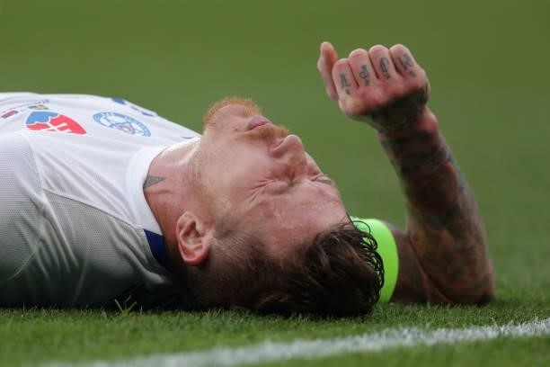 Juraj Kucka of Slovakia reacts as he appears to be injured during the UEFA Euro 2020 Championship Group E match between Sweden and Slovakia at Saint...