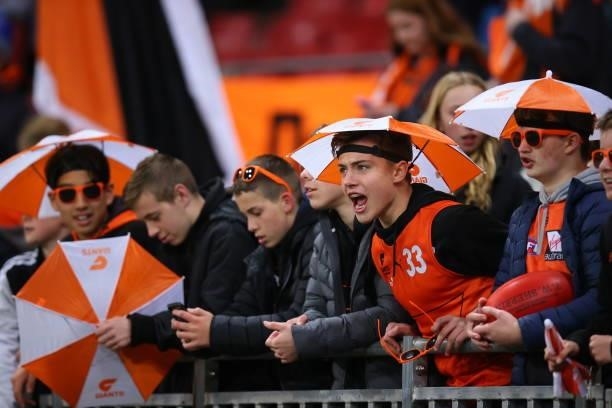 Giants fans cheer during the round 14 AFL match between the Greater Western Sydney Giants and the Carlton Blues at GIANTS Stadium on June 19, 2021 in...