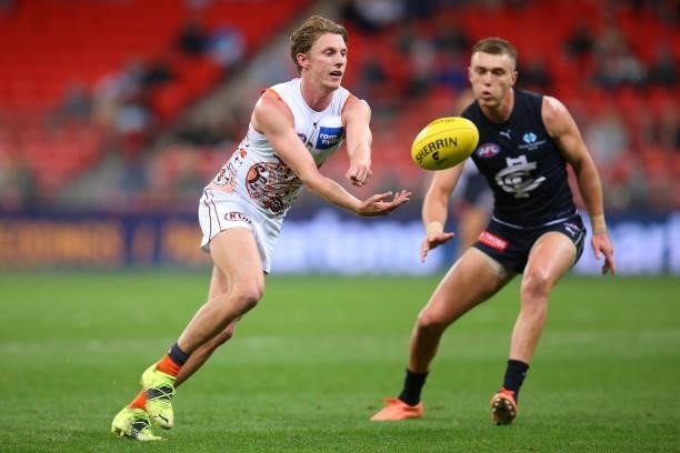 Lachie Whitfield of the Giants hand balls during the round 14 AFL match between the Greater Western Sydney Giants and the Carlton Blues at GIANTS...