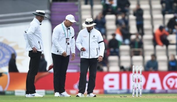 Umpires check the light as play stops for bad light during Day 2 of the ICC World Test Championship Final between India and New Zealand at Hampshire...