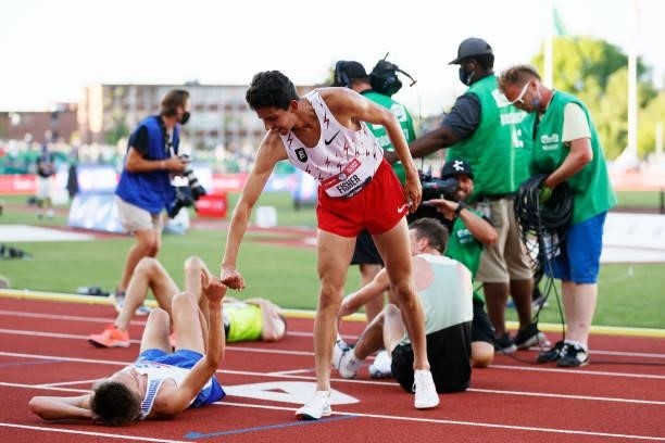 Grant Fisher congratulates another runner after finishing first in the Men's 10000 Meter during day one of the 2020 U.S. Olympic Track & Field Team...