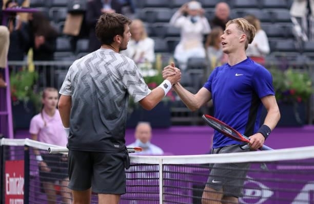 Cameron Norrie of Great Britain and Denis Shapovalov of Canada congratulate each other after their Semi-final match during Day 6 of The cinch...