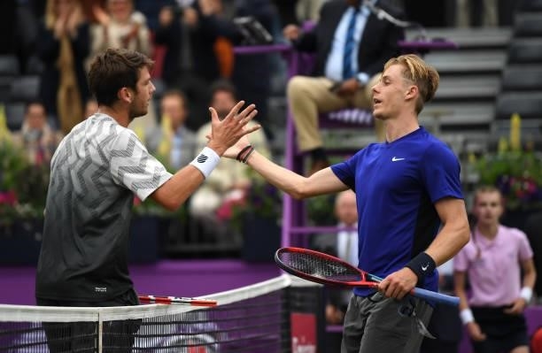 Cameron Norrie of Great Britain and Denis Shapovalov of Canada congratulate each other after their Semi-final match during Day 6 of The cinch...