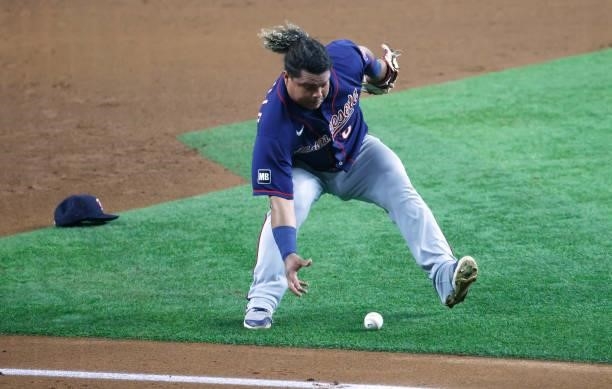 Willians Astudillo of the Minnesota Twins fields a ball off the bat of Nate Lowe of the Texas Rangers during the fourth inning at Globe Life Field on...