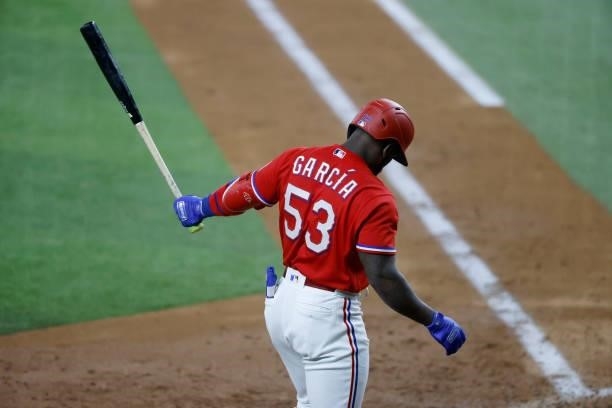 Adolis Garcia of the Texas Rangers steps away from the plate during his at bat against the Minnesota Twins during the fourth inning at Globe Life...