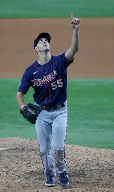 Taylor Rogers of the Minnesota Twins points at fly ball against the Texas Rangers during the eighth inning at Globe Life Field on June 18, 2021 in...