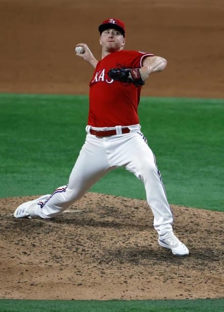 Josh Frasier of the Texas Rangers pitches against the Minnesota Twins during the tenth inning at Globe Life Field on June 18, 2021 in Arlington,...