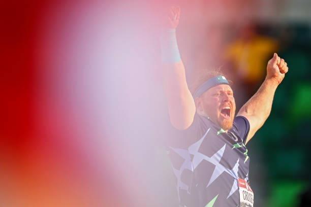 Ryan Crouser celebrates in the Men's Shot Put final after throwing for a world record of 23.37 meters during day one of the 2020 U.S. Olympic Track &...