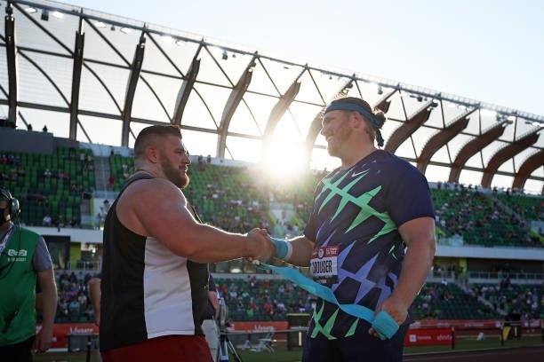 Ryan Crouser shakes hands with Joe Kovacs after competing in the Men's Shot Put final during day one of the 2020 U.S. Olympic Track & Field Team...