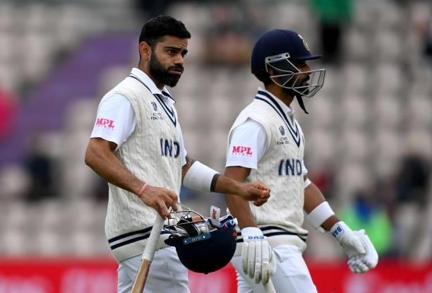 Ajinkya Rahane and Virat Kohli of India leave the field as bad light stops play during Day 2 of the ICC World Test Championship Final between India...