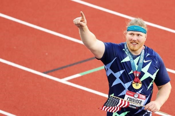 Ryan Crouser waves toward fans after throwing for a world record of 23.37 meters in the Men's Shot Put final during day one of the 2020 U.S. Olympic...