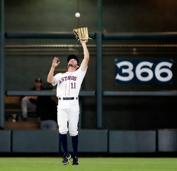 Garrett Stubbs of the Houston Astros camps under a fly ball against the Chicago White Sox at Minute Maid Park on June 17, 2021 in Houston, Texas.