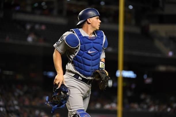 Will Smith of the Los Angeles Dodgers runs back to the dugout after the end of an inning against the Arizona Diamondbacks at Chase Field on June 18,...