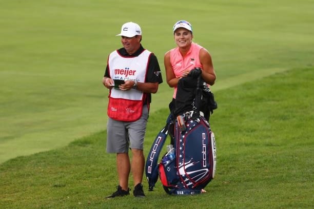 Lexi Thompson waits with her caddie to hit her second shot on the 16th hole during round three of the Meijer LPGA Classic for Simply Give at...