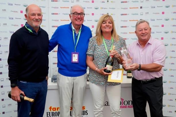 Peter Baker of England with his playing partner Jayne Fitzpatrick receives their winning prize from Eric Herd, CEO Farmfoods and Ian Woosnam after...