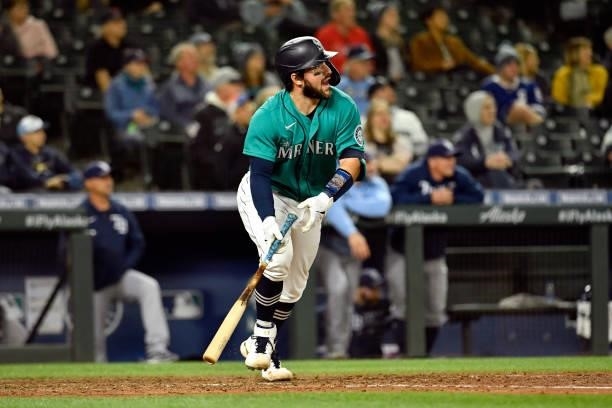 Luis Torrens of the Seattle Mariners watches the ball while running to first base during the game against the Tampa Bay Raysat T-Mobile Park on June...