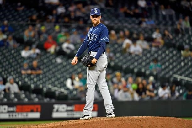 Collin McHugh of the Tampa Bay Rays eyes the runner on first base during the game against the Seattle Mariners at T-Mobile Park on June 18, 2021 in...